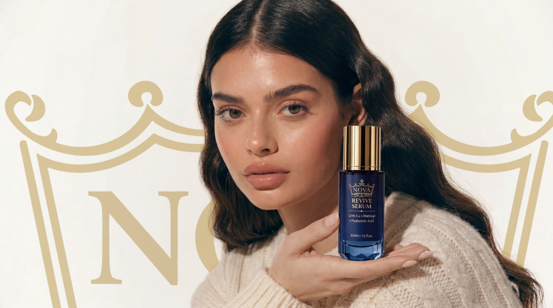 Woman holding a blue skincare serum bottle with a decorative background